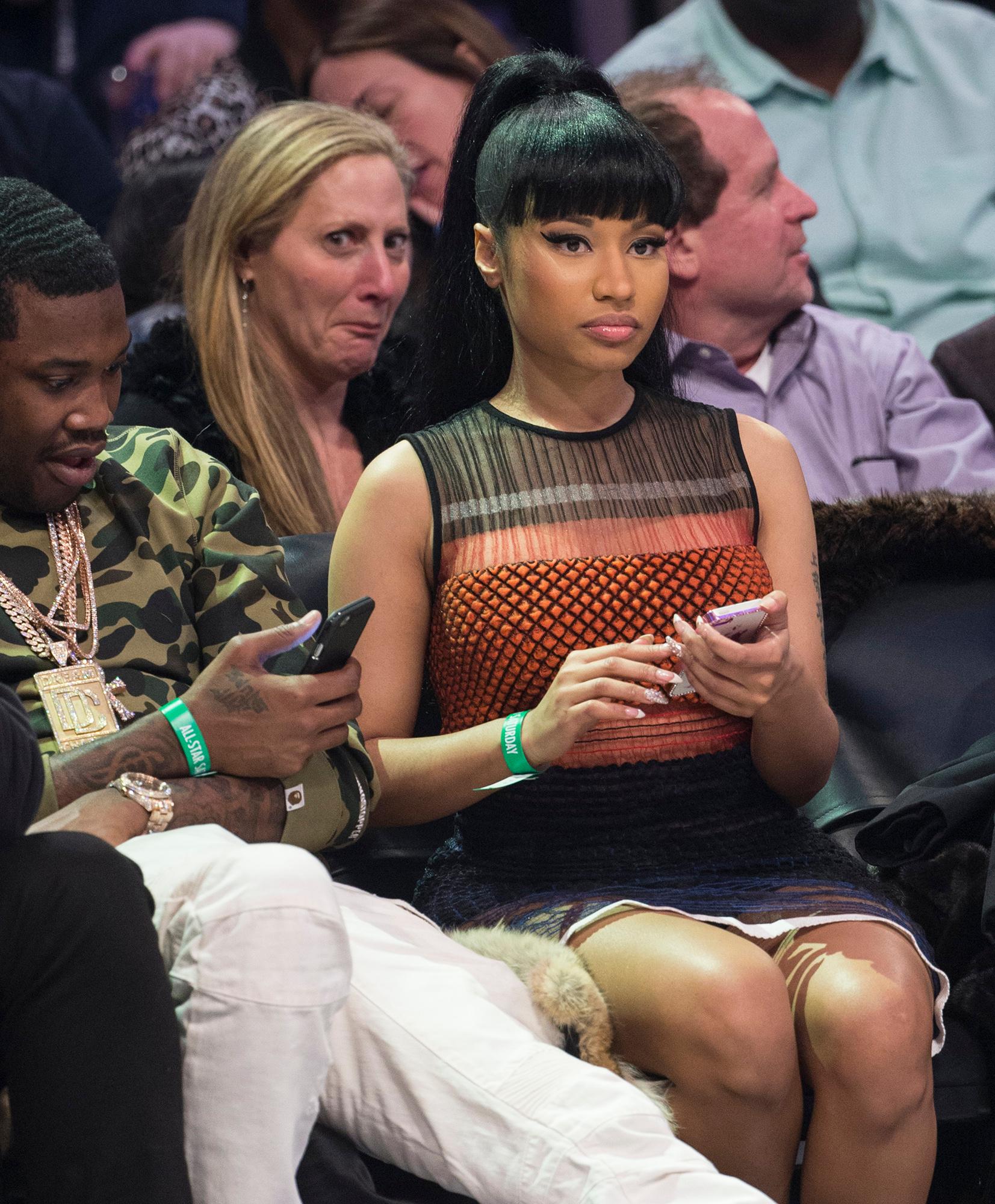 Nicki Minaj sits court side enjoying the NBA All Star Slam Dunk Contest at Barclays Center