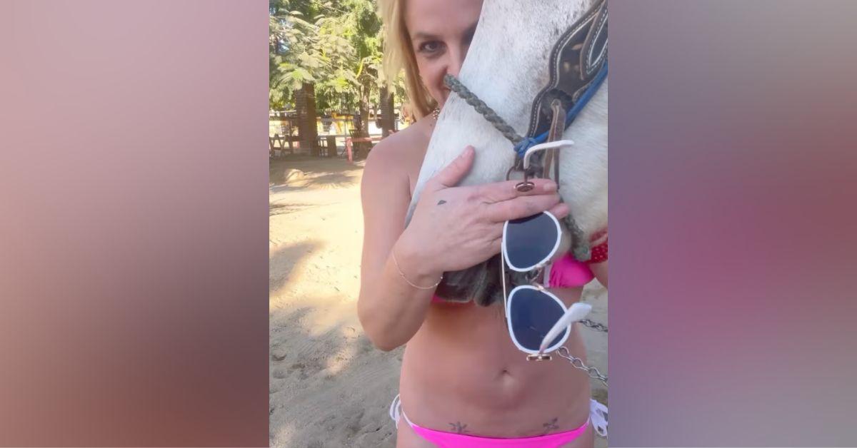 britney spears cuddles horse pink bikini boots