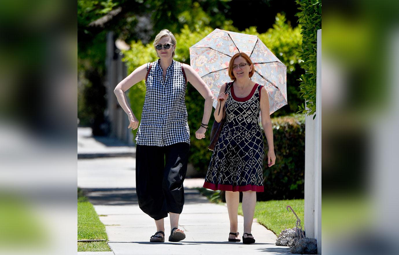 jane lynch and jennifer walking together