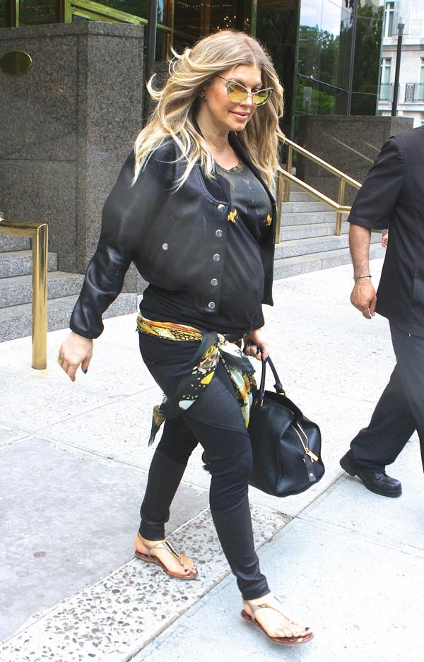 Fergie steps out in NYC wearing a tight leather outfit and funky sunglasses