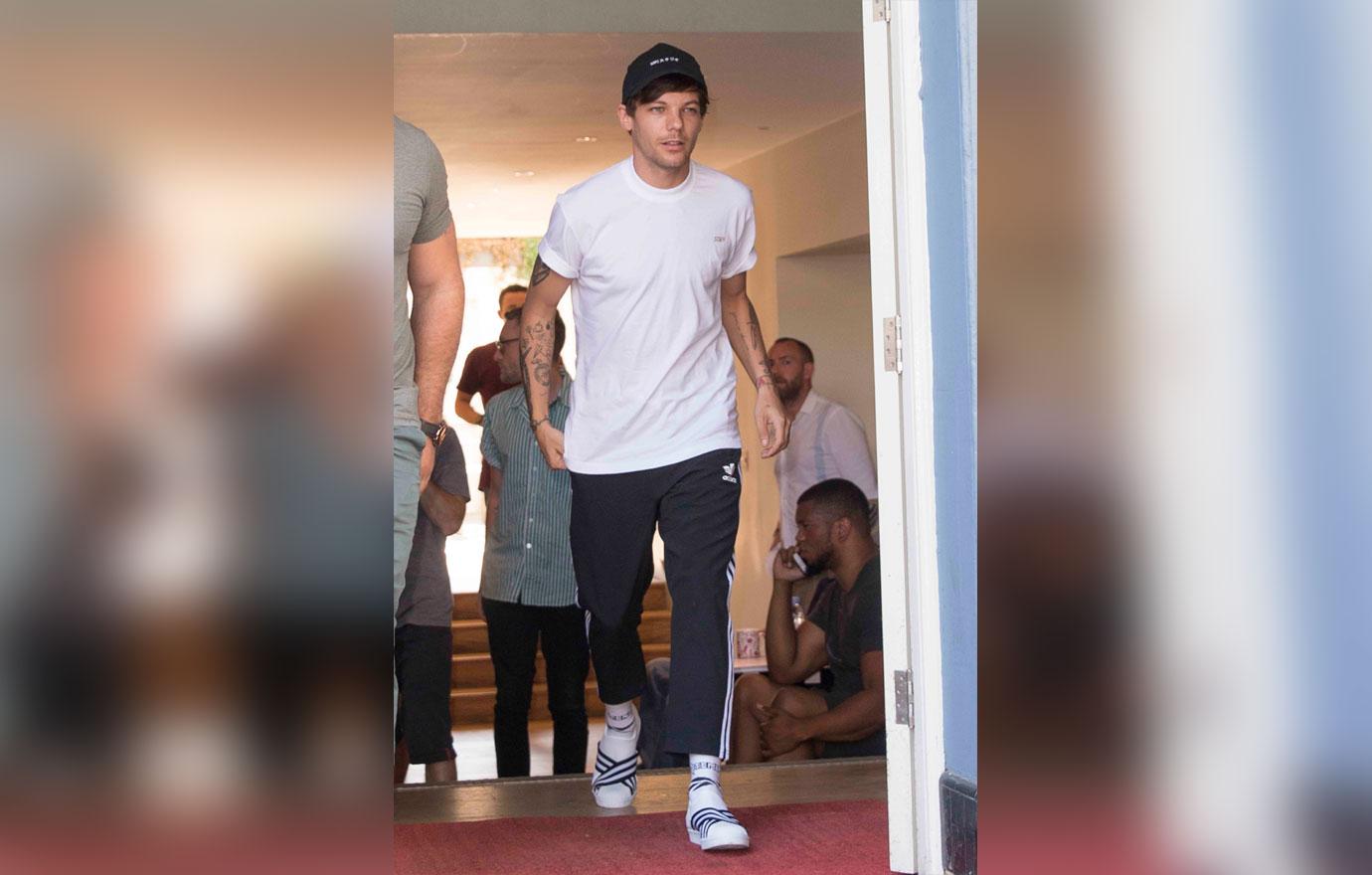 Louis Tomlinson Wearing White Tee Shirt And Joggers