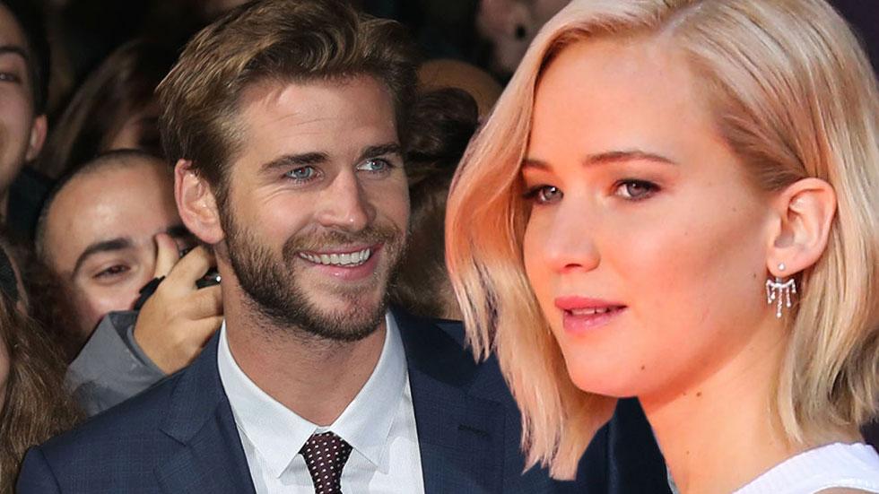 Jennifer lawrence liam hemsworths sparks flying hunger games mockingjay press tour