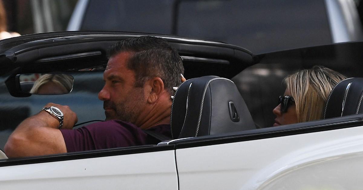 image of The pair rode around in a convertible.