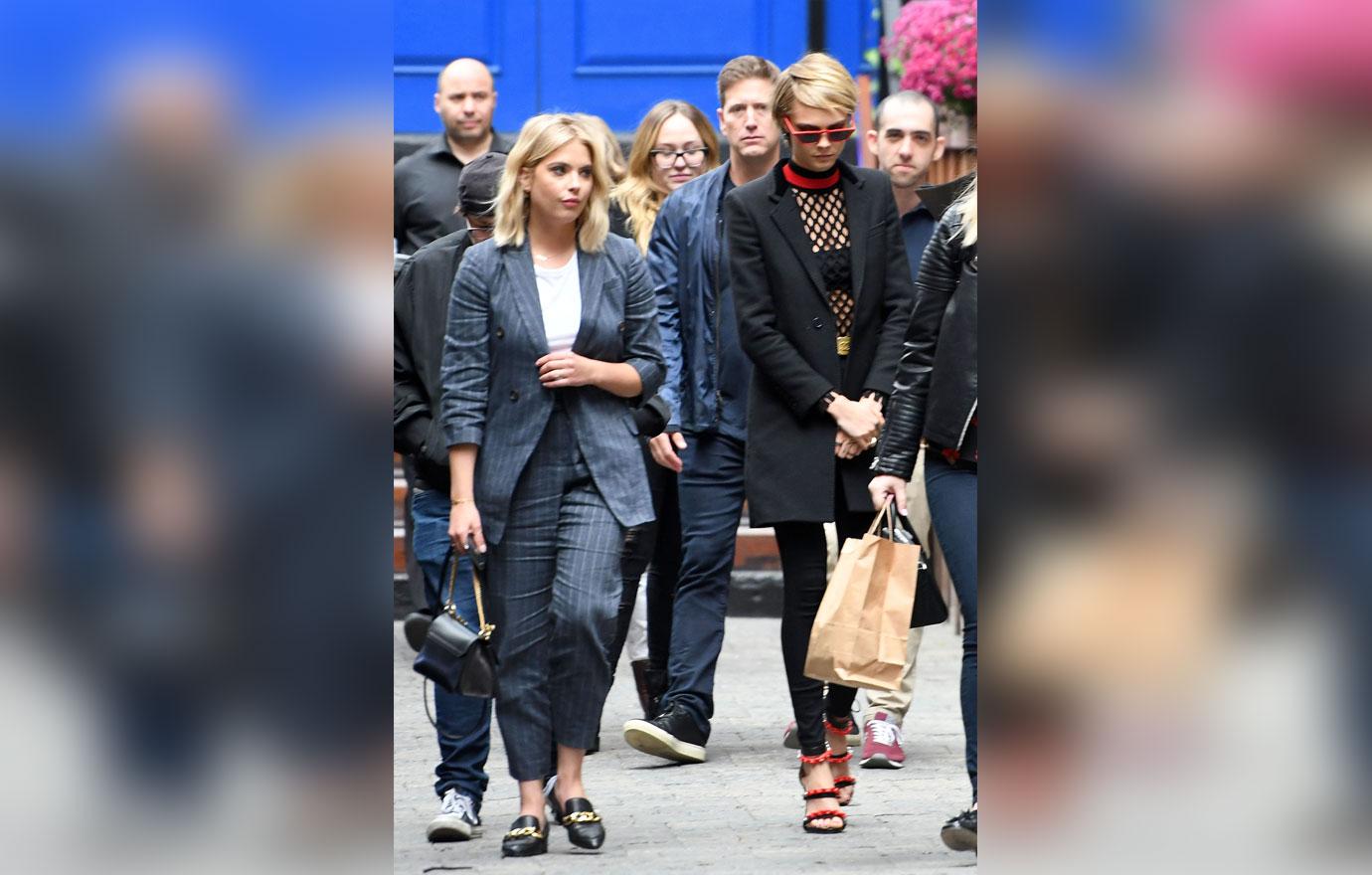 Ashley Benson and Cara Delevingne spotted laughing over a text message during TIFF