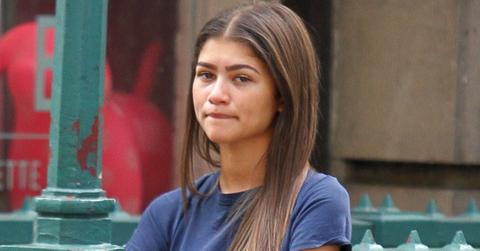 A barefaced Zendaya gives peace signs in NYC