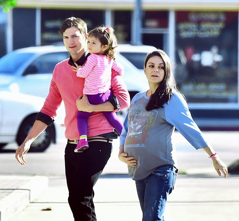 A very pregnant Mila Kunis along with husband Ashton Kutcher head to breakfast with daughter Wyatt in Studio City, CA