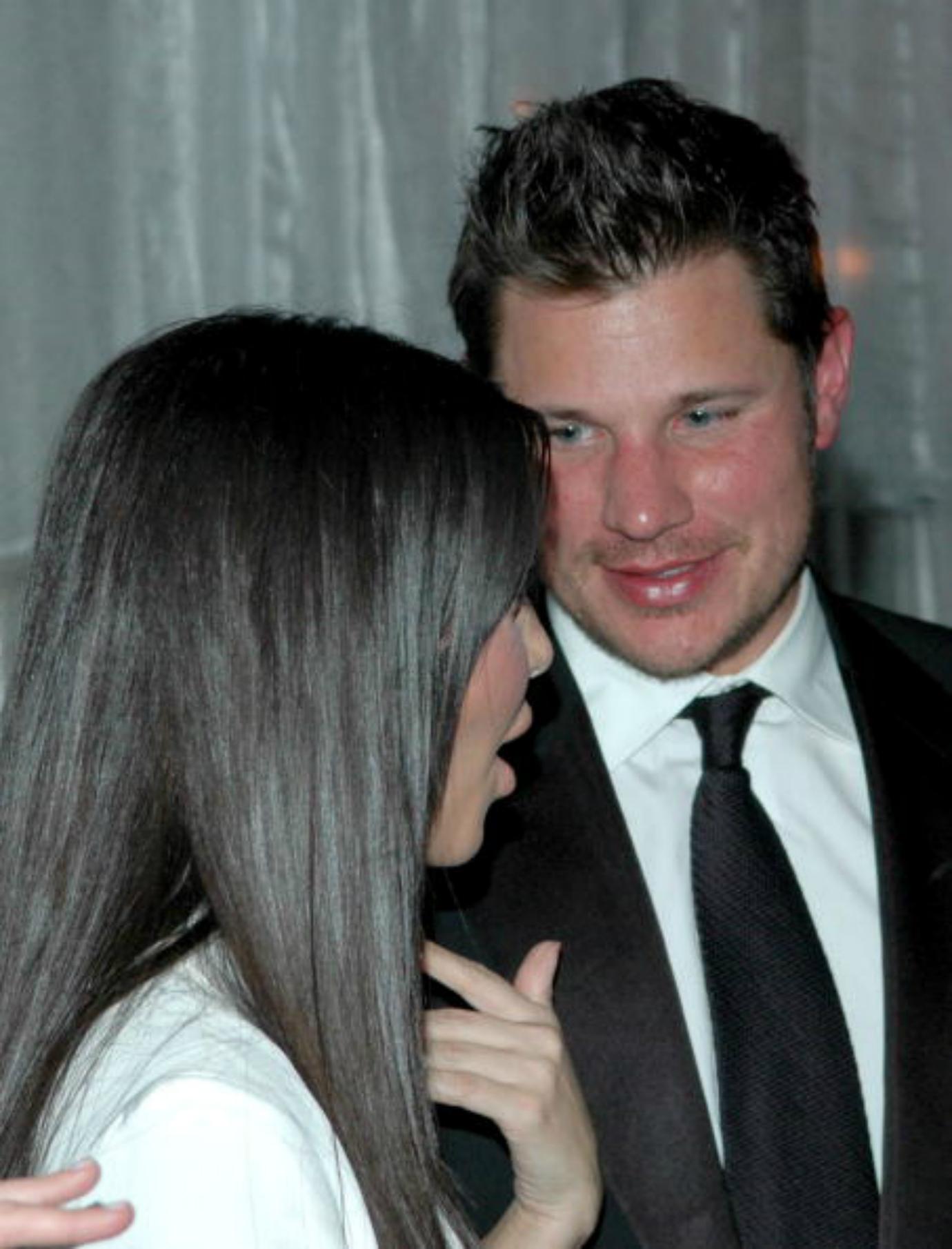 Kim Kardashian and Nick Lachey talk to each other.