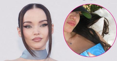 dove cameron goes topless covers chest with book