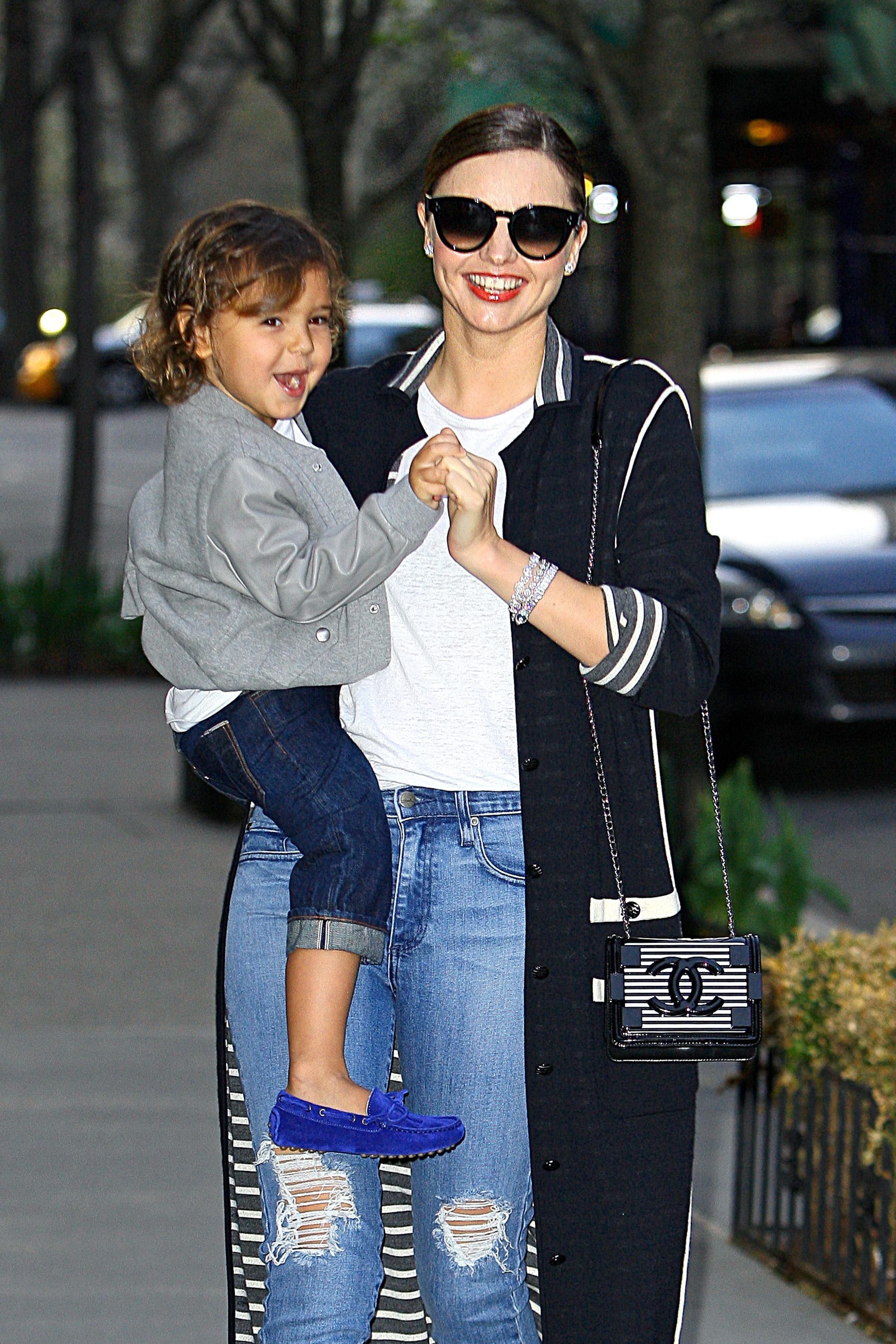 Miranda Kerr and son Flynn are all smiles as they leave their NYC apartment