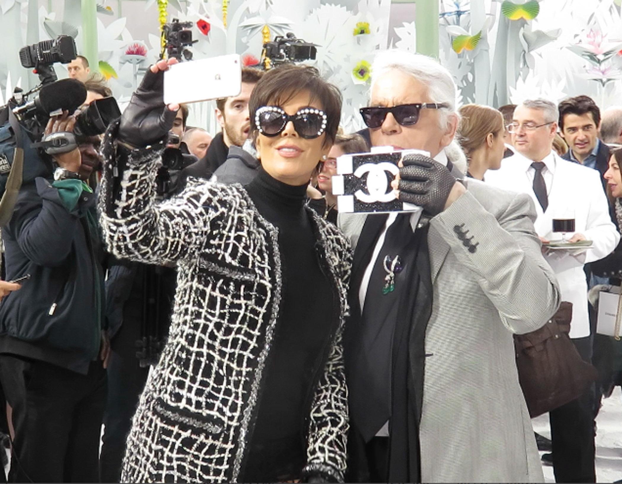 Kris Jenner and Karl Lagerfeld pose for selfies backstage at Chanel, Paris fashion show