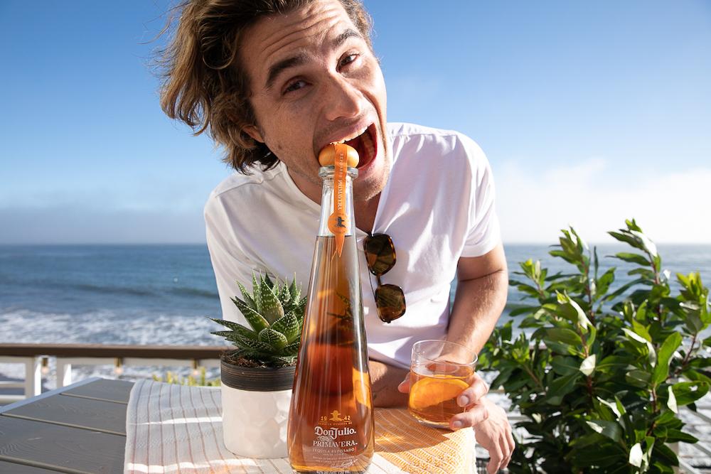 chase stokes taking a bite out of his new role with tequila don julio primavera while filming with the limited edition tequila in malibu ca