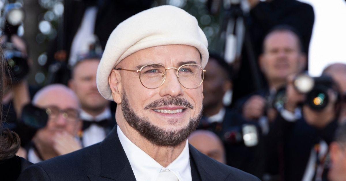 image of John Travolta revealed his viral Cannes beret looks were inspired by 'old-school' film directors from past decades.