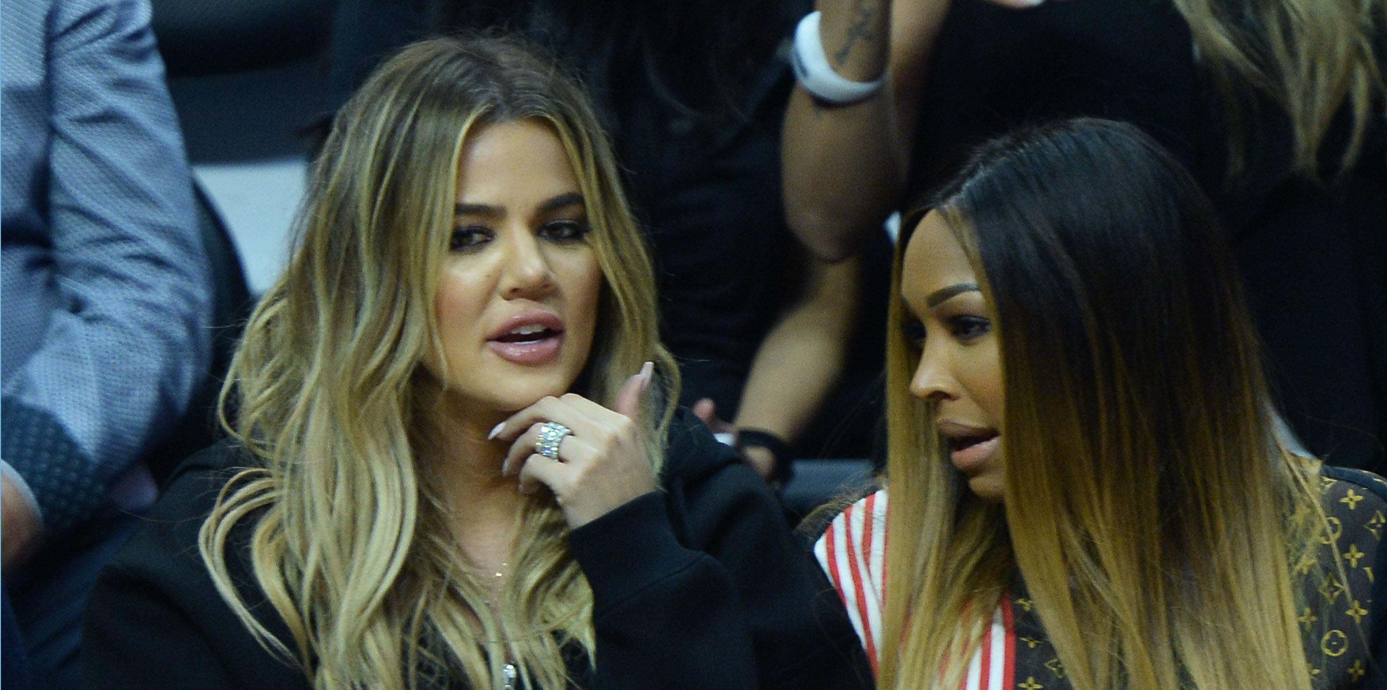 Khloe Kardashian cheers on Tristan Thompson as she sports a ring next to BFF Malika Haqq