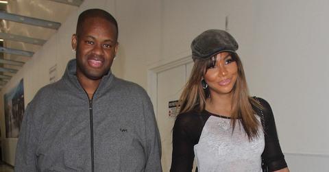 Tamar Braxton and Vincent Herbert depart LAX with their hands locked