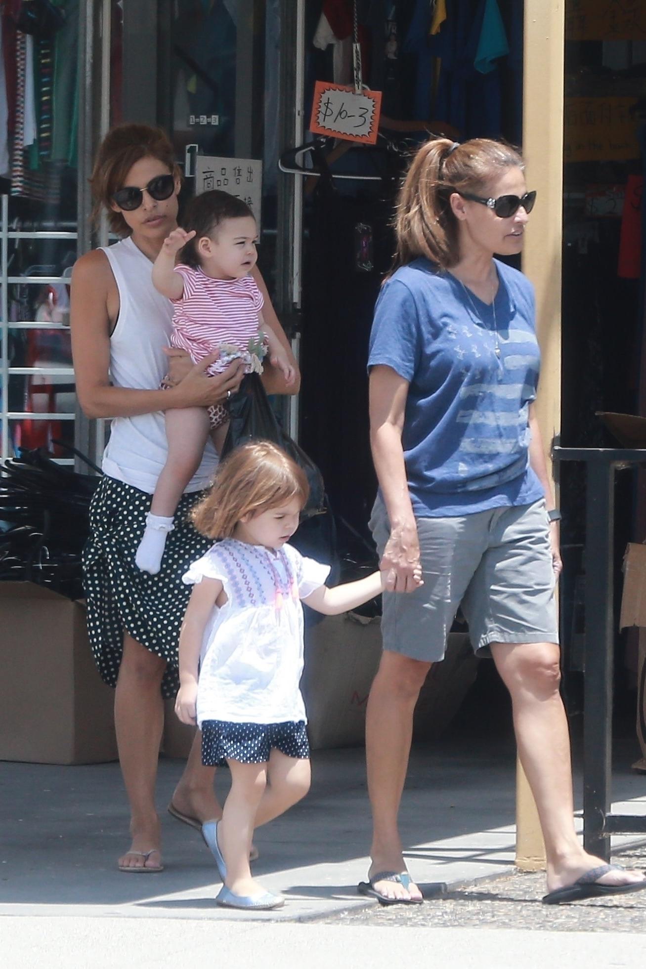 *EXCLUSIVE* Eva Mendes and her sister take the little ones shopping