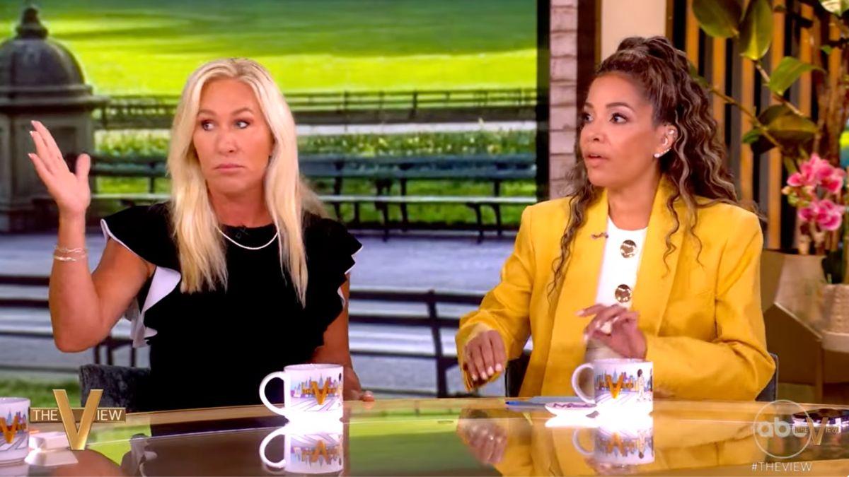 Photo of Sunny Hostin brought her phone out to read MTG's post word for word.
