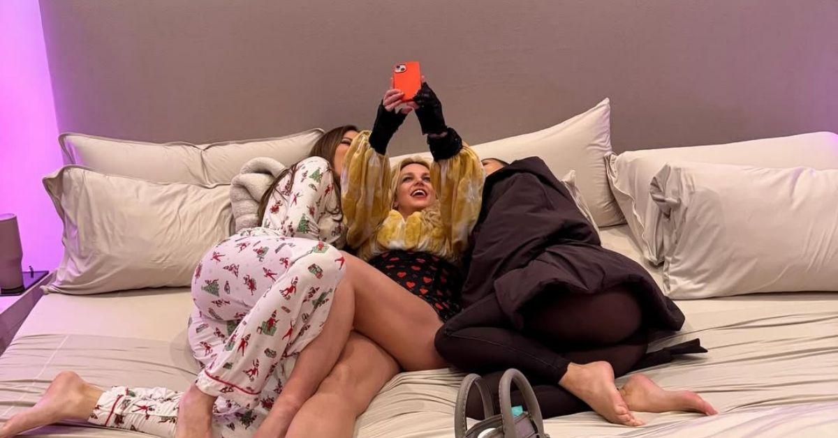 image of Kim Kardashian posted a cozy selfie with Khloé Kardashian and Britney Spears from their sleepover.