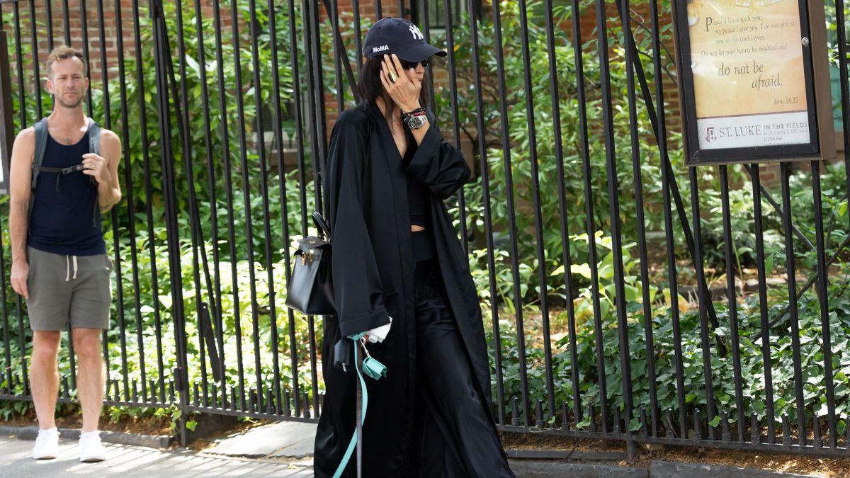 Photo of Irina Shayk elevated her casual daytime outfit with a long oversized coat.