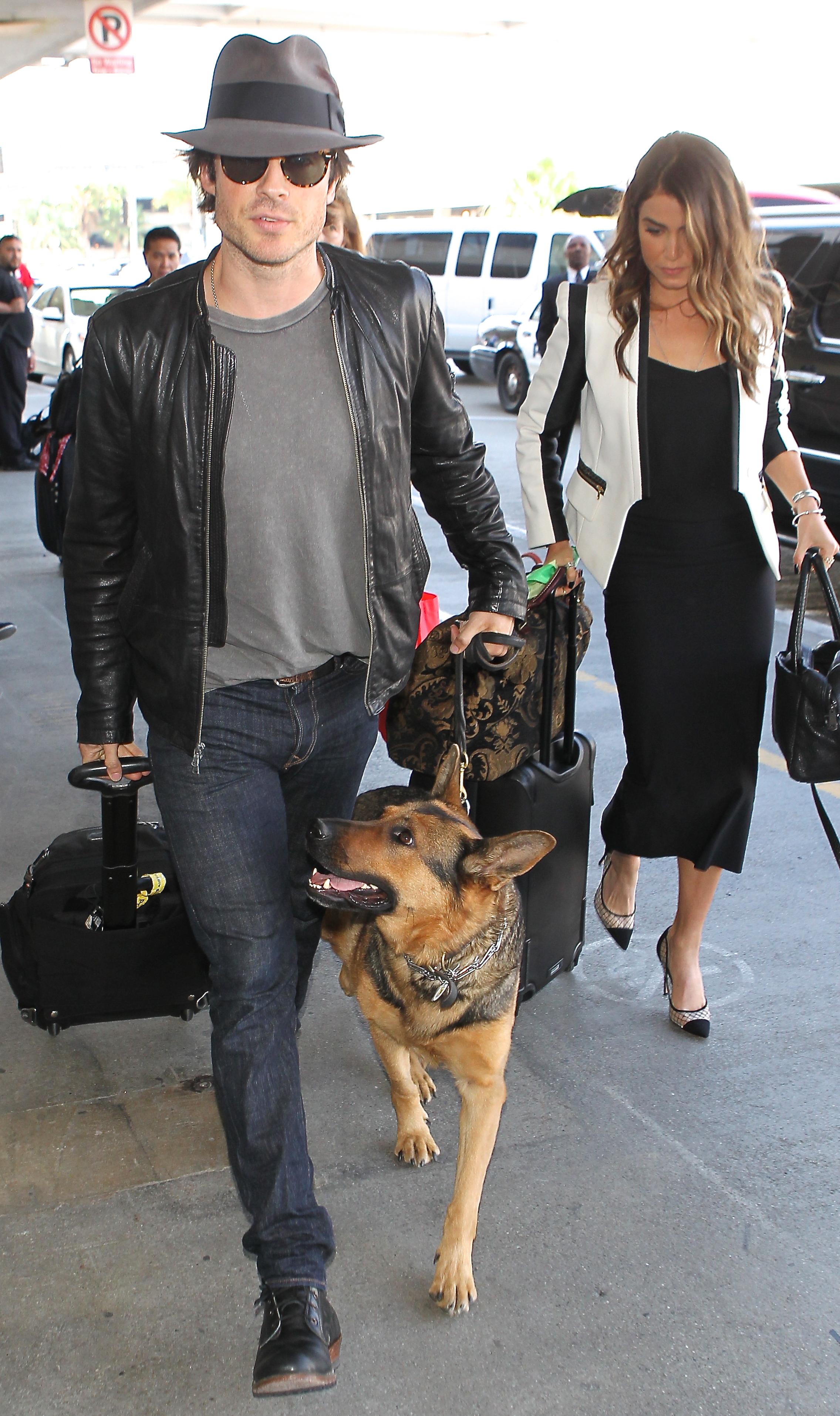 Ian Somerhalder, Nikki Reed and their dog arrive back in LA at LAX