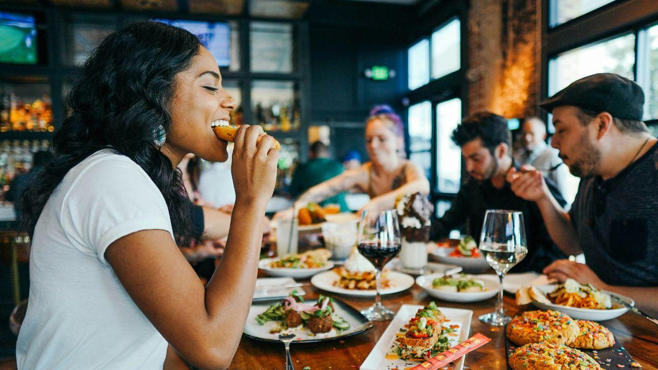 Image of customers continued to debate tipping expectations and workers' wages following the bar's controversial post.