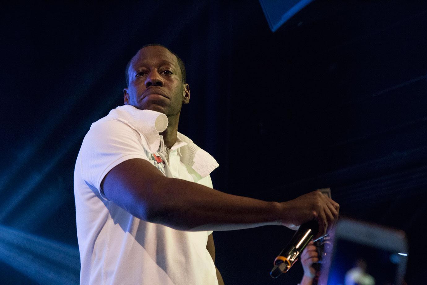 Young Dro Holding Mic While Performing Onstage