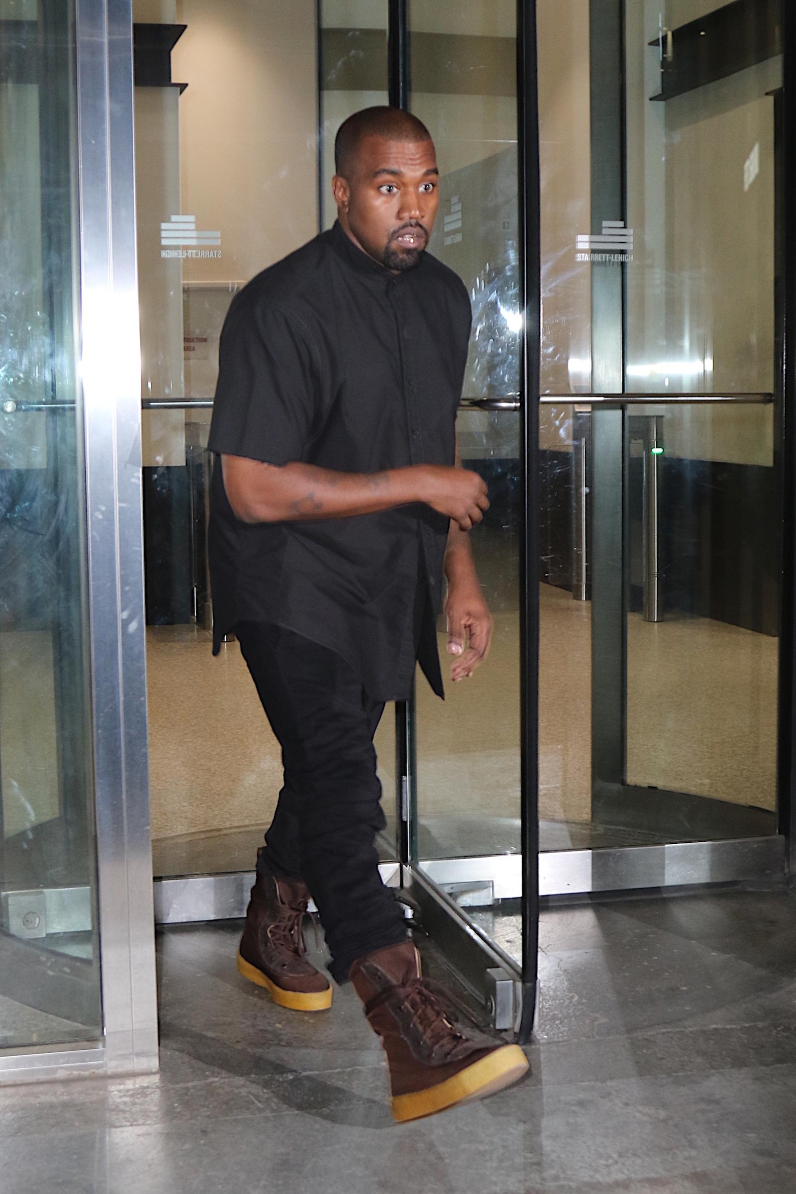 Kanye West was spotted this evening leaving office in Midtown before heading out to dinner with Kim Kardashian