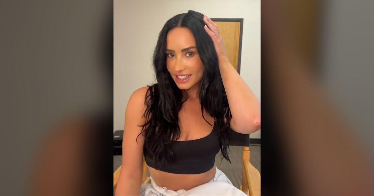 demi lovato bares cleavage sports bra cool for the summer tribute watch