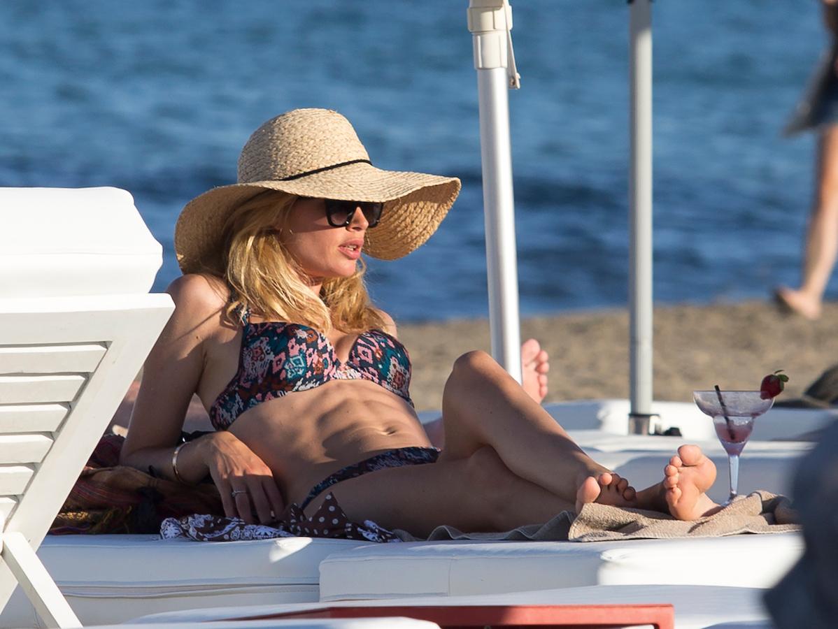 Supermodel Doutzen Kroes shows off her incredible bikini body as she soaks up the sun on the beach in Ibiza.