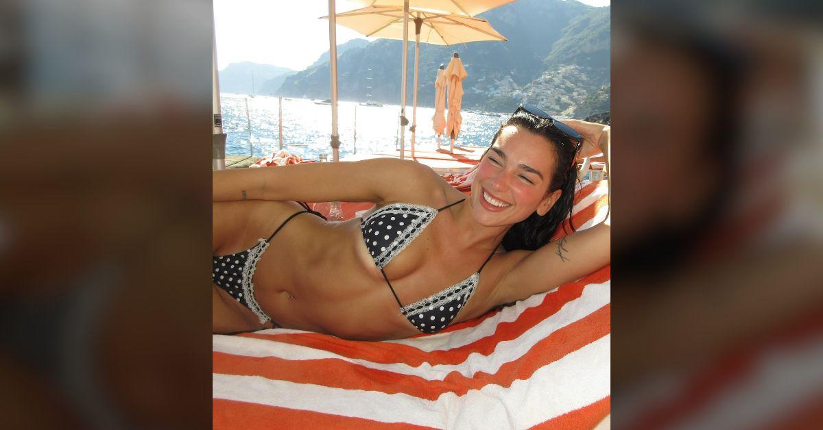 dua lipa spills out tiny polka dot bikini italy callum turner photos