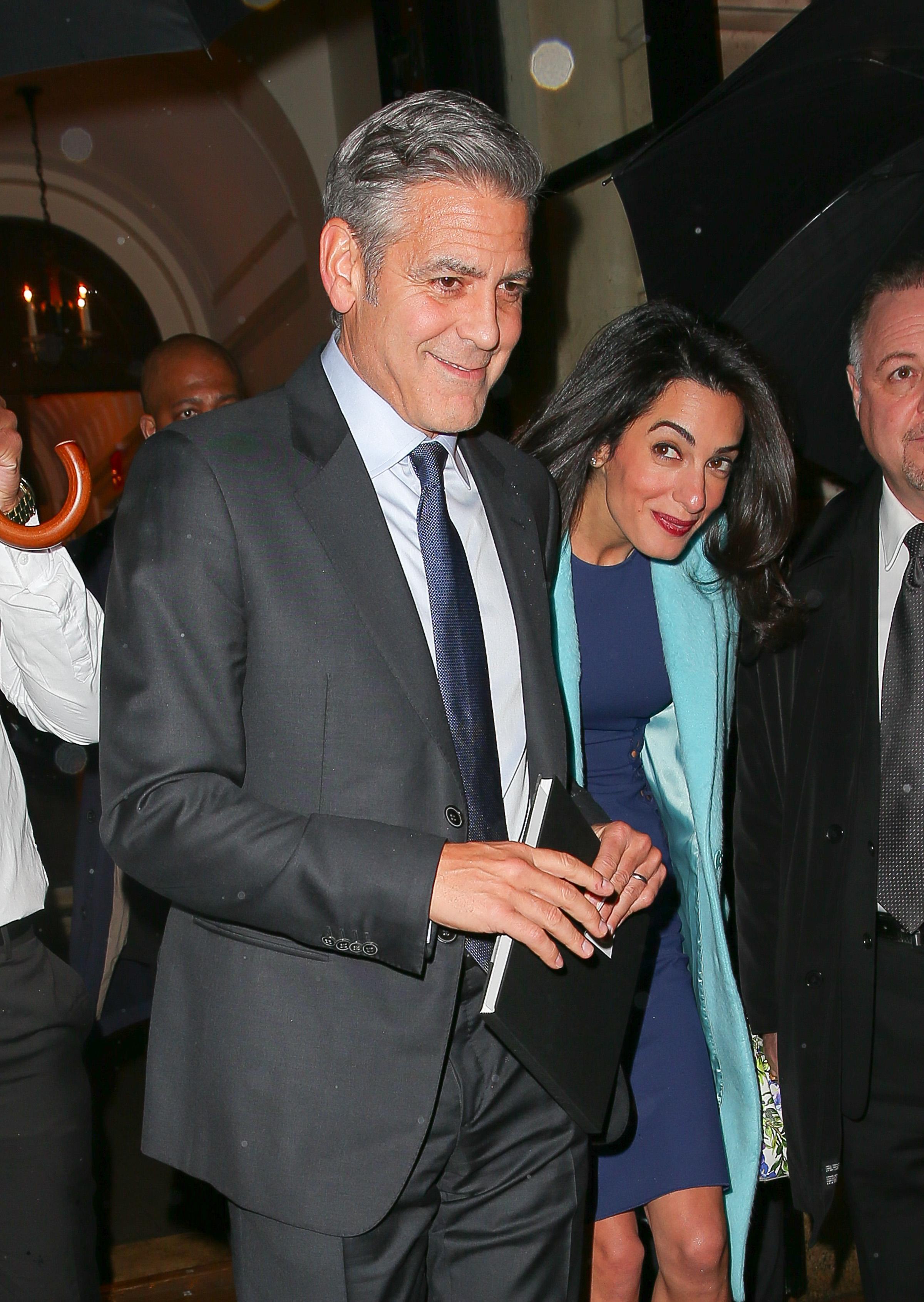 EXCLUSIVE: George Clooney and Amal Clooney spotted all smiles while arm in arm leaving a charity dinner in New York City