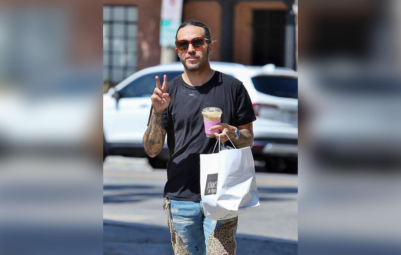 EXCLUSIVE: Pete Wentz looks stylish while getting a drink and food to go