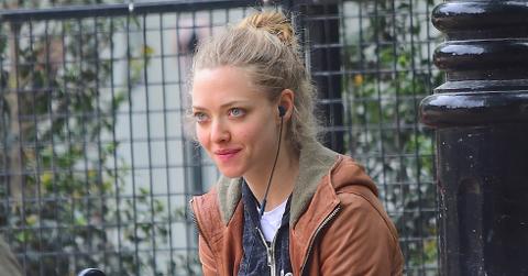 Amanda Seyfried makes friends with all the dogs at the park in NYC