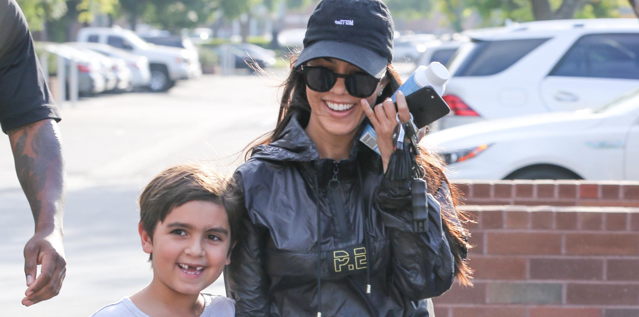 Kourtney Kardashian is all smiles as she leaves her sons art class