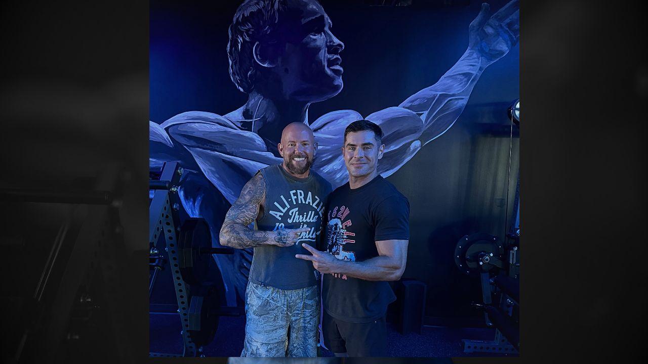 Image of Efron and Buhler in a gym.