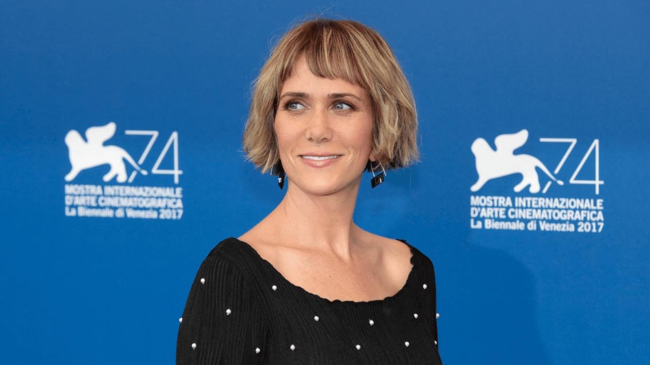 Photo of Kristen Wiig debuted a darker hair color during the Paris Fashion Week appearance.