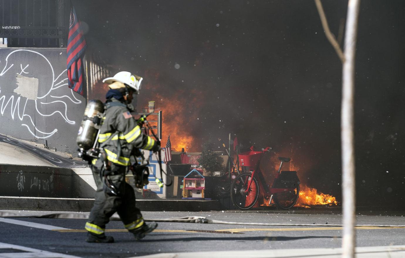 olice and firefighters respond to a fire at a homeless encampment near the U.S. Capitol in Washington, DC on Monday, January 18, 2021. 