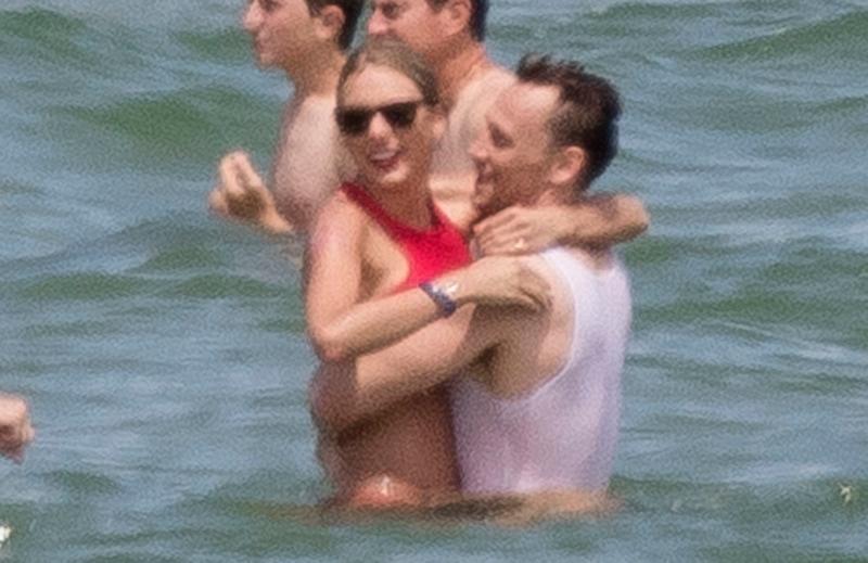 EXCLUSIVE: Taylor Swift embraces, passionately kisses Tom Hiddleston in the ocean with her friends Gigi Hadid, Karlie Kloss, Cara Delevingne, Ruby Rose, Blake Lively and Ryan Reynolds nearby on 4th of July weekend in Rhode Island