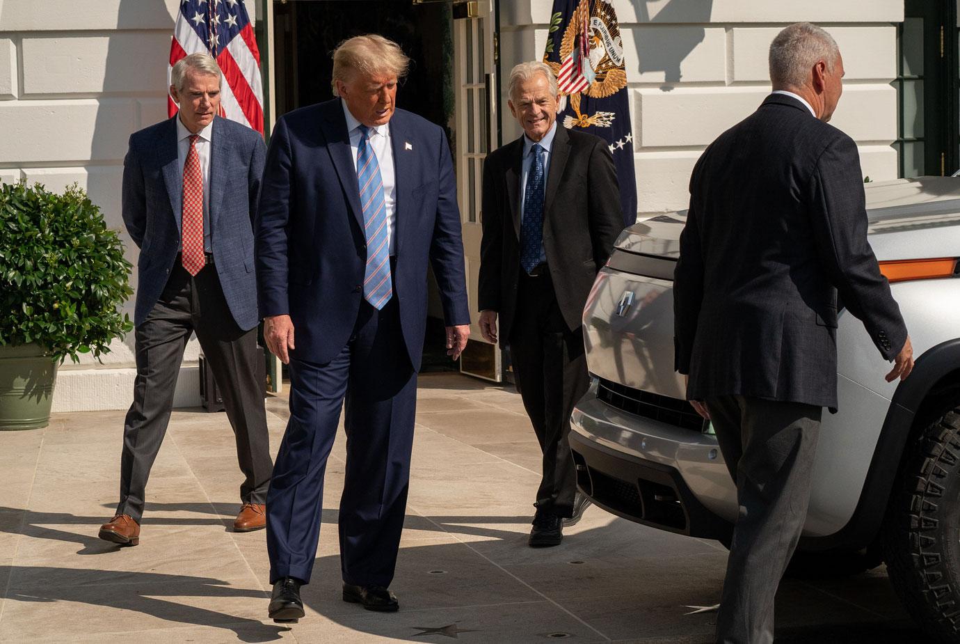 Trump Walking By A Car