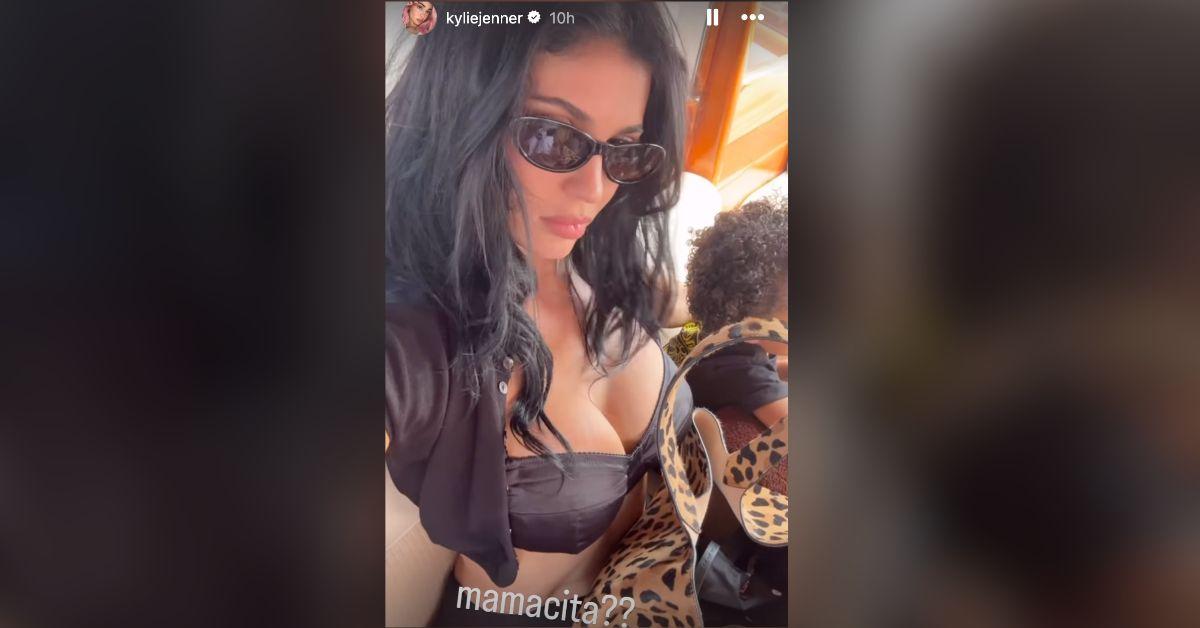 kylie jenner strips down tiny black bikini boating kids photo