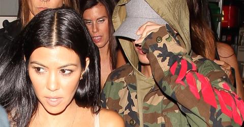 Kourtney Kardashian and Justin Bieber looking happy walking out of The Good Guy together