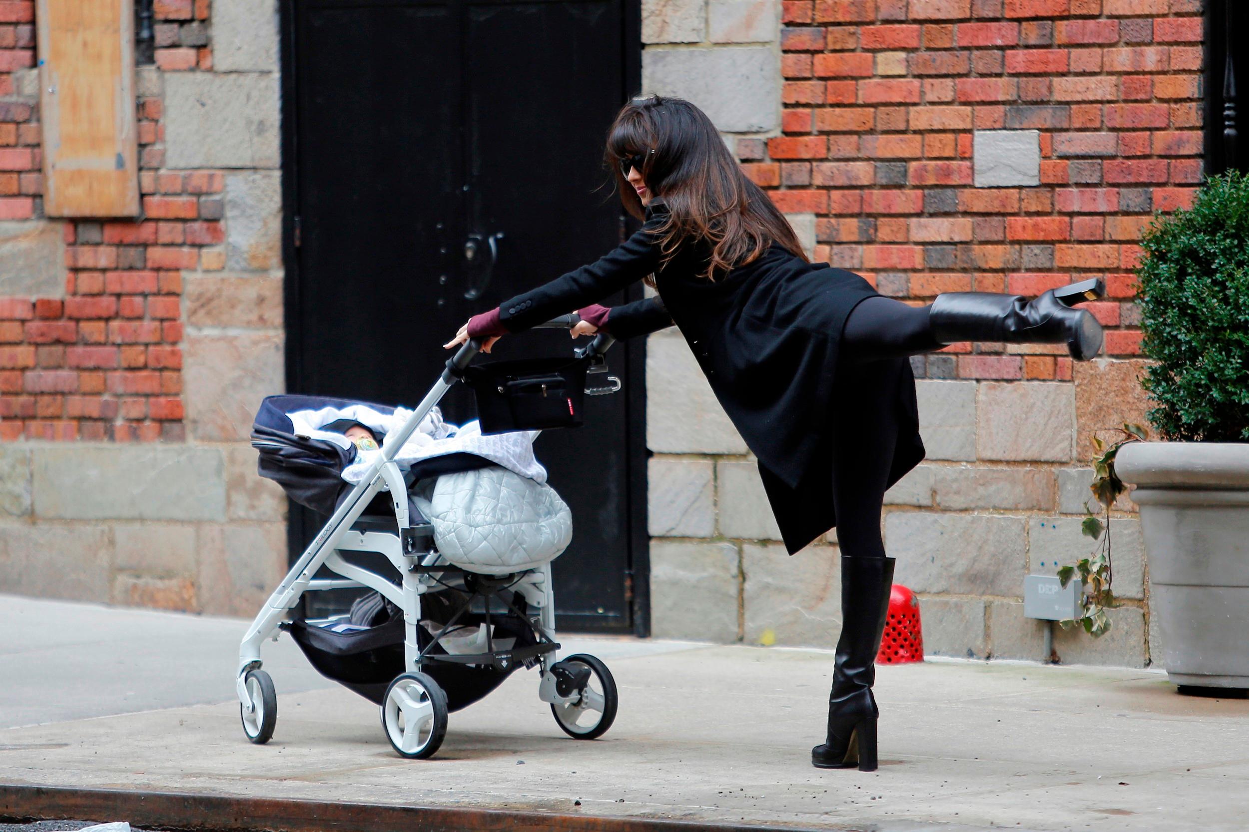 Hilaria Baldwin shares her high-heeled, buggy-pushing yoga pose of the day