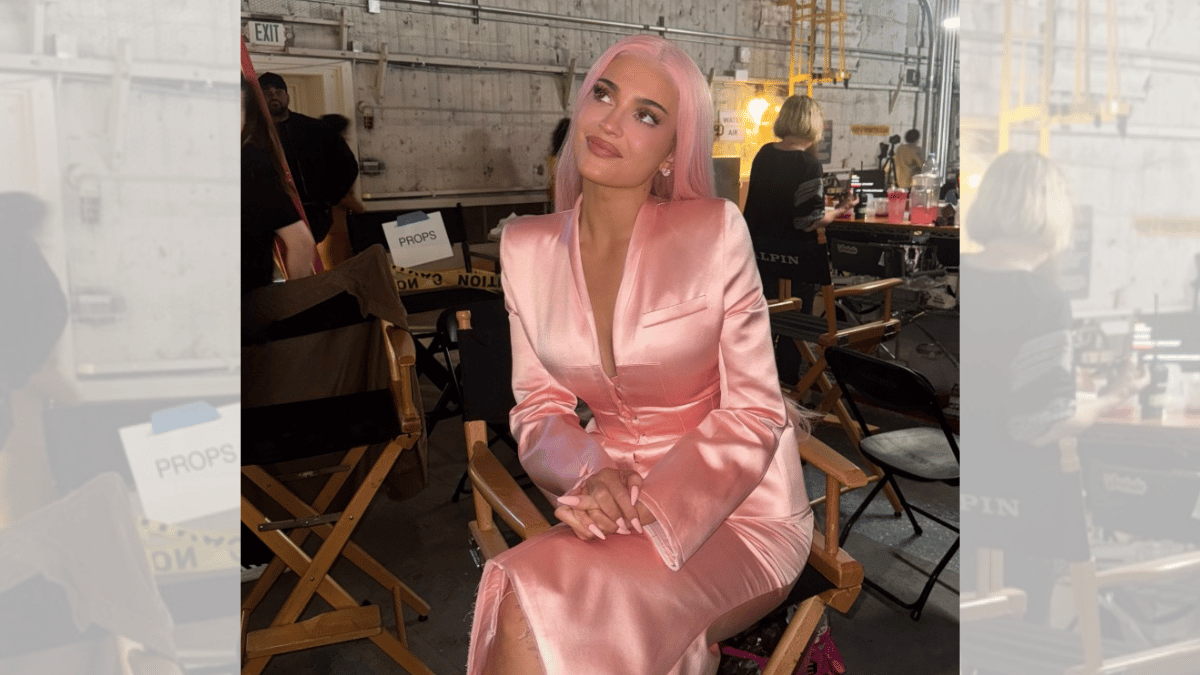 Image of Kylie Jenner wore a matching pink suit for the video. 