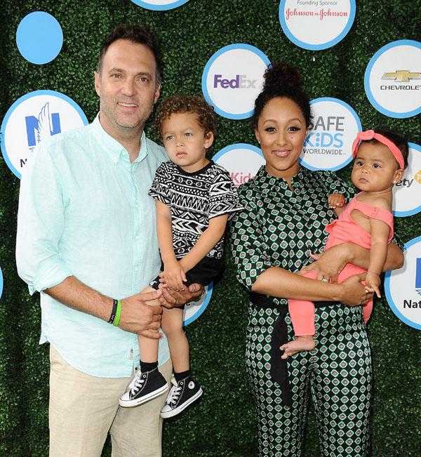 Tamera mowry adam housley cuddle aden ariah 04