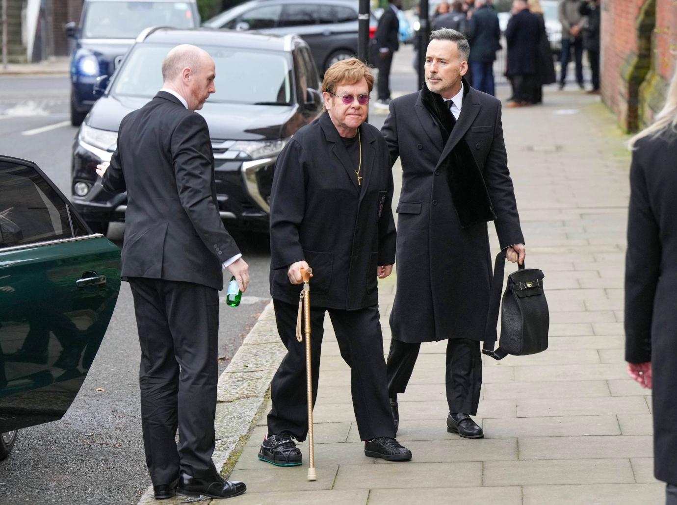 elton john sparks health concerns cane injured foot photos