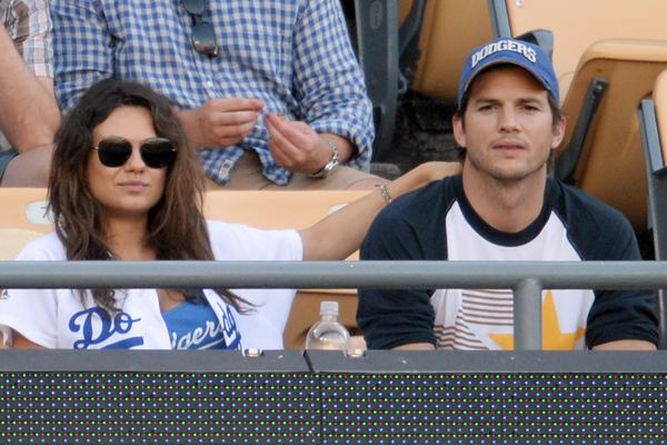 Mila Kunis and Ashton Kutcher kiss at LA Dogers v St Louis Cardinals, Los Angeles