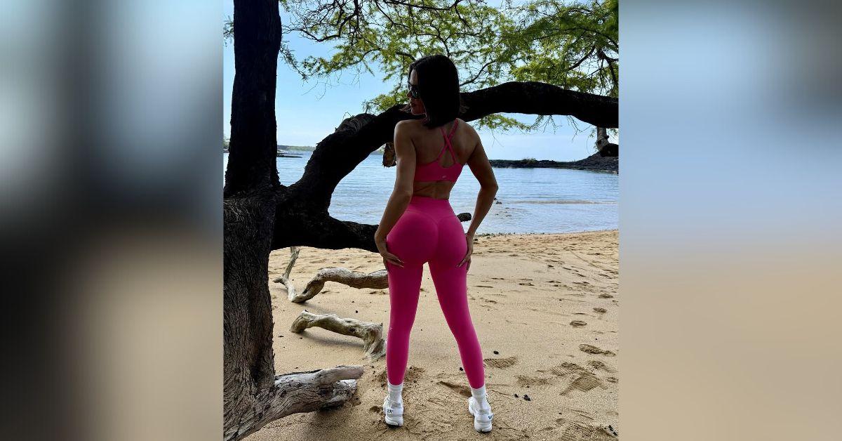 khloe kardashian fit figure spills out sports bra