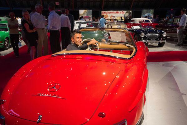 Gilles Marini checks out the iconic 1960 Mercedes Benz 300 SL Roadster at Auctions America California auction