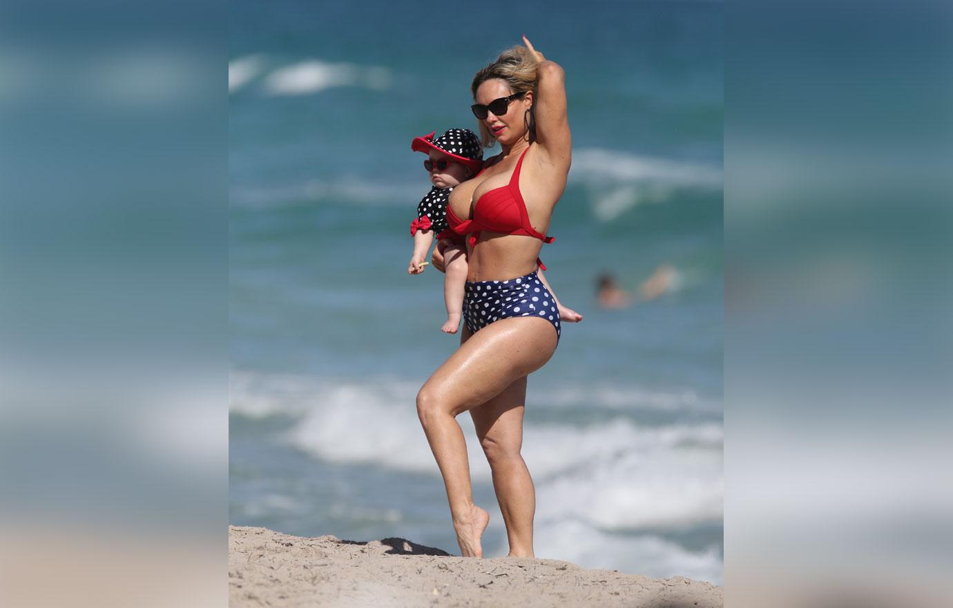 Coco Austin enjoys a day at the beach with her daughter in Miami