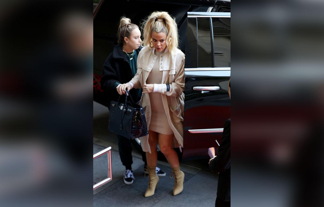 A pregnant Khloe Kardashian is seen arriving at a hotel for a meeting