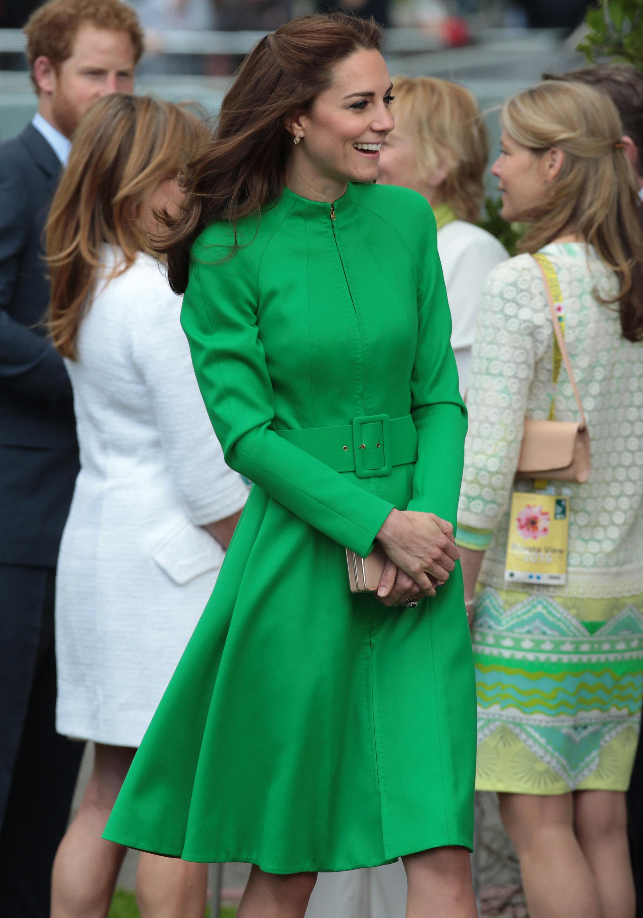 Hiding Something? Kate Middleton Covers Her Stomach In A Stunning ...